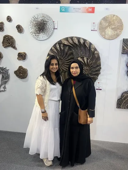 It's always an honor to meet fellow art lovers. Posing with a visitor at my booth during the art show in Qatar.