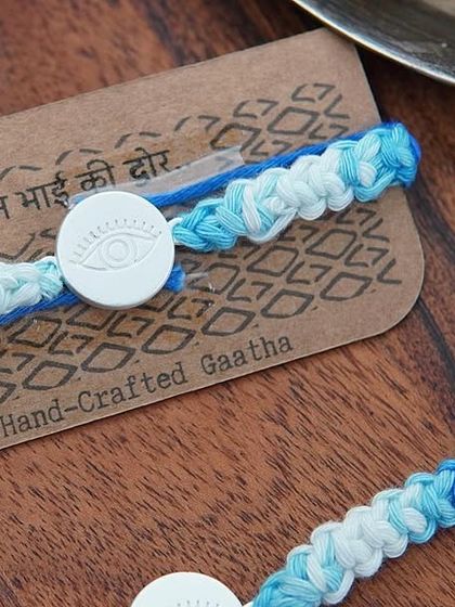 The Silver Evil Eye Rakhi set, a truly special handcrafted piece.