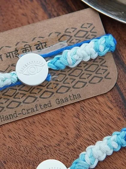 The Silver Evil Eye Rakhi set, a truly special handcrafted piece.