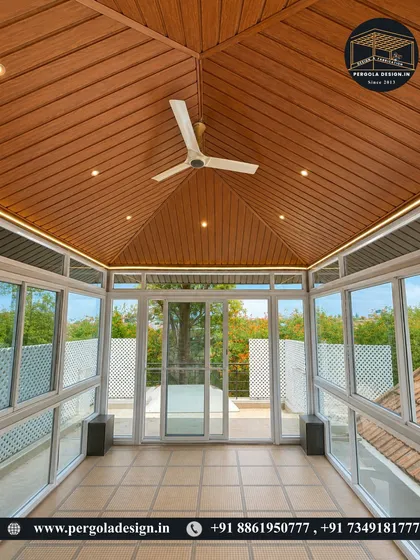 Step inside your personal, all-weather retreat. This view from within a completed glass room shows how we seamlessly blend the comfort of the indoors with the beauty of the outdoors, featuring a premium wood-finish ceiling, integrated fan, and panoramic views.