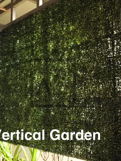 This is a classic, dense artificial boxwood hedge panel. It's a great choice for creating a simple, clean green wall for privacy or as a background feature.