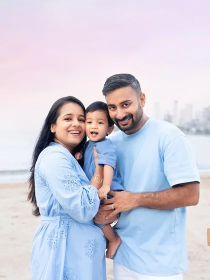 Seas the day! A beautiful family portrait on the beach, with the Mumbai skyline in the background. A baby's first beach photoshoot is always a special one.