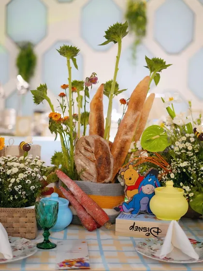 Another creative centerpiece with bread, carrots, and characters, bringing the storybook to life.
