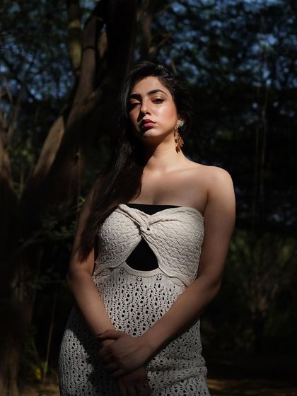 A sun-kissed portrait from a shoot in the woods, using natural light to create a beautiful, dramatic effect.