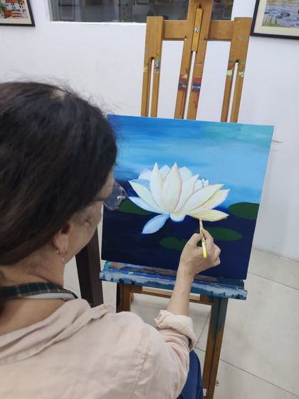The journey of a lotus painting, from the first strokes of the background to the delicate shading on the petals.