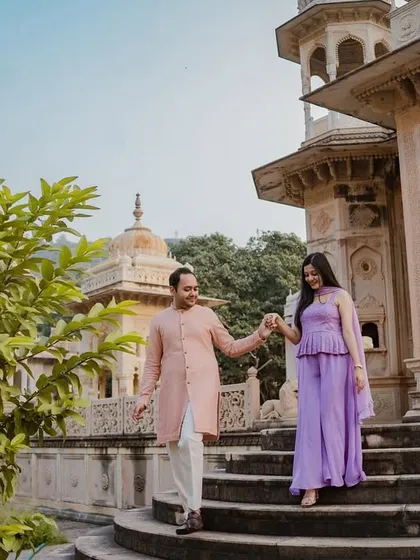 We guide our couples through magnificent locations, capturing natural movement and interaction. Here, Raghav leads Tanisha down the historic steps, creating a candid moment that feels both grand and personal.
