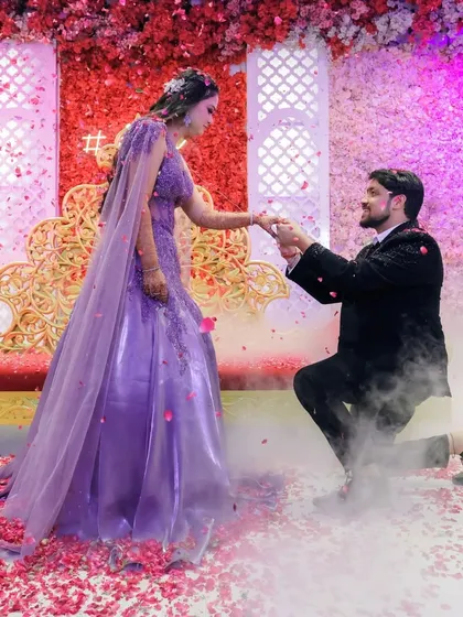 A fairytale proposal moment, complete with smoke effects and a shower of petals. I aim to make your engagement photos look as magical as the moment felt.