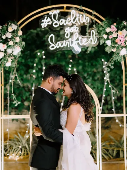 A modern engagement setting with a personalized neon sign. I work with you to incorporate unique, contemporary touches that reflect your personality as a couple.