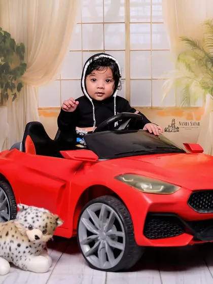 For the little car enthusiast, this 'Little Driver' theme is a hit. I use a stylish red toy car and a simple, elegant backdrop to keep the focus on your child's happy expressions as they take the wheel.