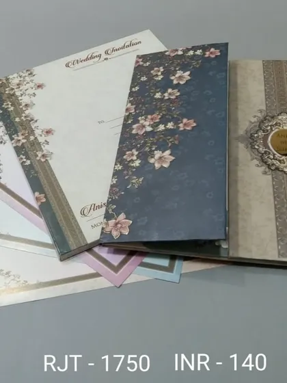 This vertical invitation set features a variety of floral patterns, from a dark blue cover to lighter pastel inserts. It's a versatile design for a stylish wedding.