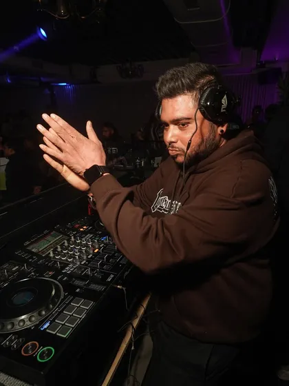 Hyping up the crowd during a pre-Diwali party. The celebration starts early and the energy just keeps building.