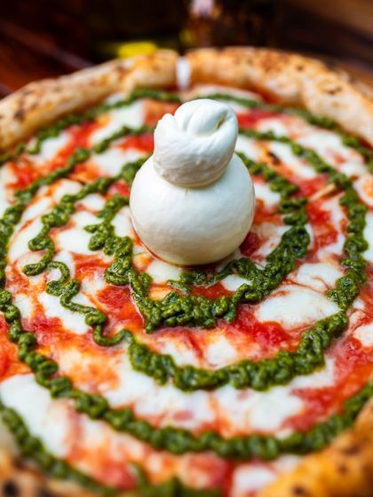 Wood-fired, charred just right, and made with love. Our Burrata Pesto pizza hits different.