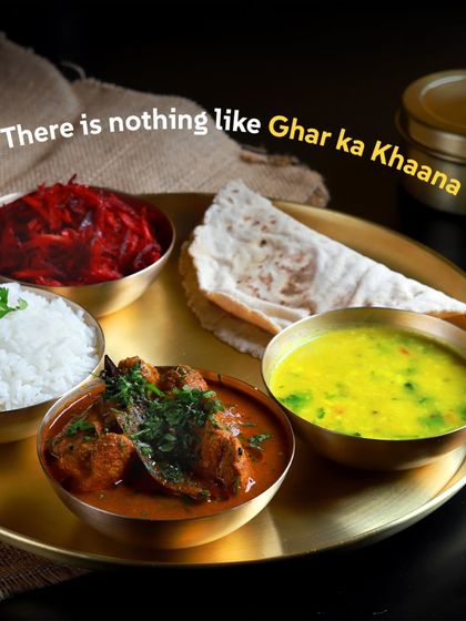 There is nothing like Ghar ka Khaana. This beautiful non-veg thali with chicken curry, dal, rice, and roti proves just that.