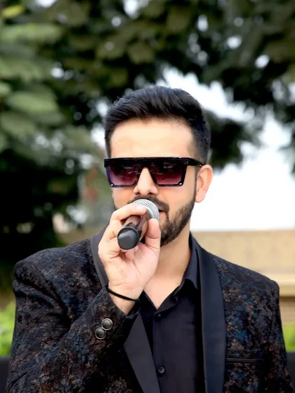 A close-up shot of me hosting the outdoor segment of the Capri Loans annual meet.
