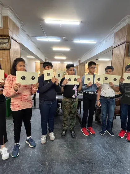 Another happy group of kids after their shooting session. We focus on making the sport accessible and enjoyable for our youngest visitors.