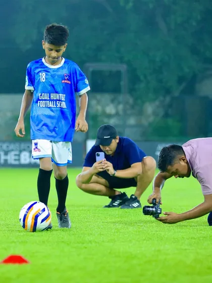 Capturing the perfect shot. A behind-the-scenes look at a photoshoot with one of our young players.
