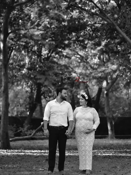 A timeless black and white photo of a couple walking hand-in-hand through the park. This classic style emphasizes the emotion and connection of the moment.