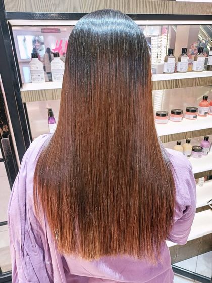 The "after" result of the Hair Botox, revealing smoother, straighter hair with a healthy, glossy finish.