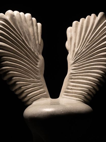 A close-up of the intricately carved wings from our Pakhru Collection. Each line is carefully shaped to capture the essence of feathers, turning a solid material like concrete into something that feels light and full of movement.