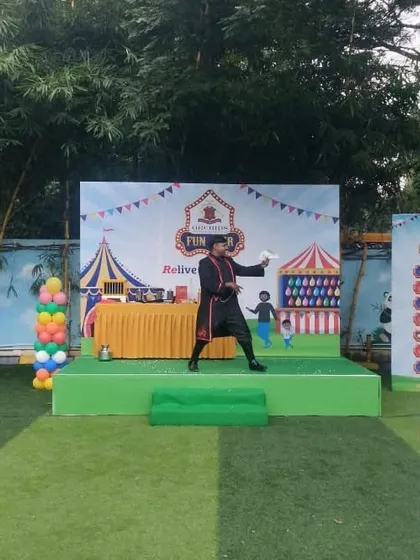 A moment of misdirection during my performance at the school fun fair. Keeping the audience guessing is a key part of the fun.