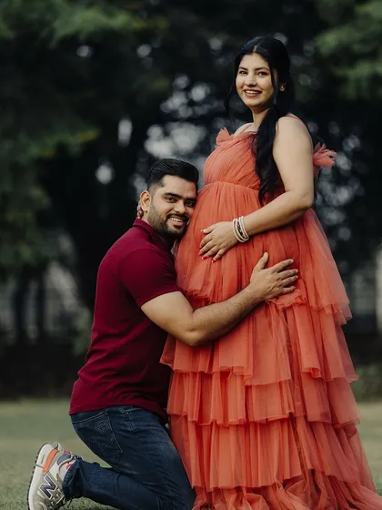 An adorable shot of the dad-to-be listening to the baby bump. These are the precious moments our outfits get to be a part of.