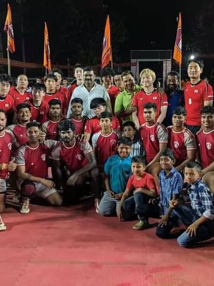 A historic group photo with both the Vijay Club and Japan teams after the match.