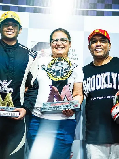 A driver celebrates his Meritus Cup Vice-Championship with his family. Their support is the foundation upon which our racers build their careers.