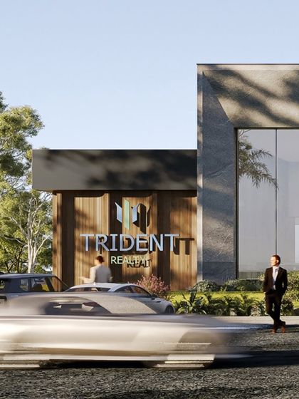 The entrance to the Trident Realty experience center, showcasing a careful balance of natural textures, sleek lines, and inviting open spaces. The design creates an immersive environment that embodies comfort and sophistication.
