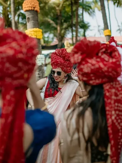 A candid shot of a guest dancing in the baraat, capturing the fun and energy of the procession.