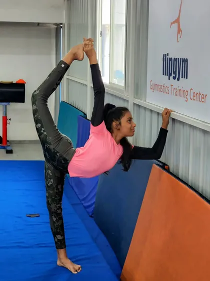 Flexibility is a key benefit of gymnastics. We incorporate dedicated stretching and conditioning into our classes to help students improve their range of motion, as shown by this impressive standing split.
