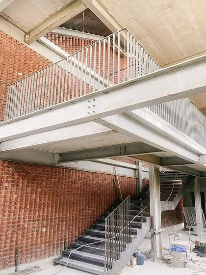 A wider view of the steel structure at Play Arena, showing the interplay of beams and columns.