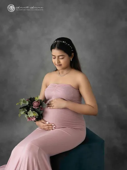 Simple, elegant, and timeless. A classic studio portrait against a textured grey backdrop allows your beautiful bump and radiant glow to be the complete focus of the image.