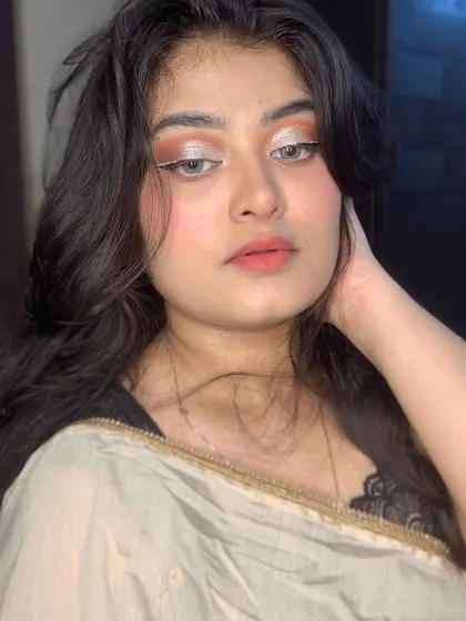 A full-face view of the soft and glamorous silver eye look.