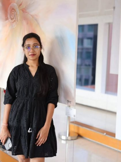 A visitor admiring the art at the 'Nature's Symphony' exhibition.
