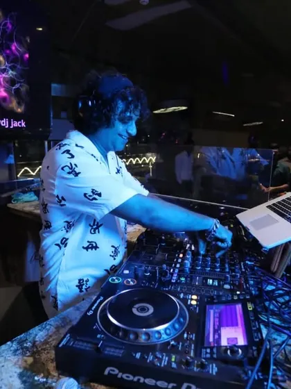 In the zone at the console, surrounded by cool blue lights and a great sound system. This is my happy place, where I get to share the music I love.