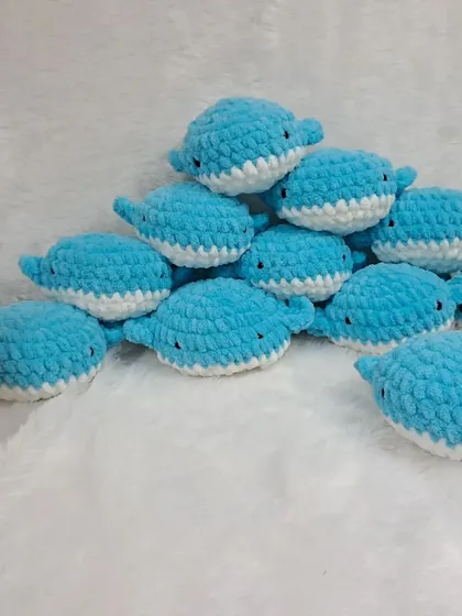 A pyramid of my blue whale soft toys. These are very popular as birthday return gifts for ocean-themed parties.