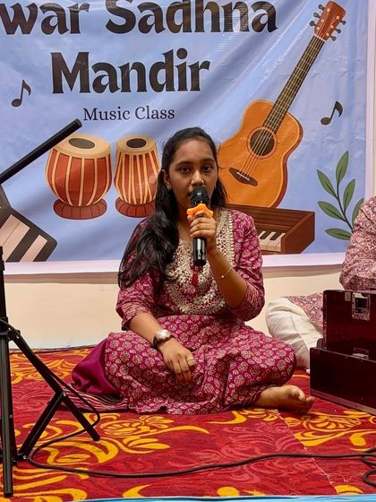 An adult student presenting her performance. It is never too late to learn, and we are so proud of our adult learners who embrace their passion for music with such dedication.