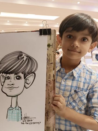 This boy's expression is perfectly captured in his caricature. It's all about observing and sketching quickly.