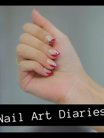 A final look at the hand-painted bow design. This style is great for adding a touch of personality to a classic French tip look.