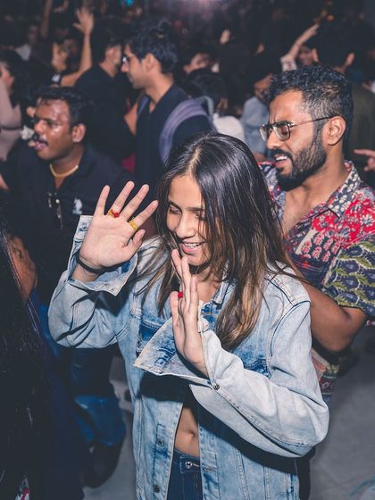 A candid shot of people enjoying the music. It's these moments of pure, uninhibited fun that I aim to create.