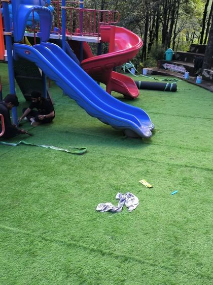 My team at work during the installation in Nainital. We ensure every seam is perfect and the entire surface is smooth and secure for kids to play on.
