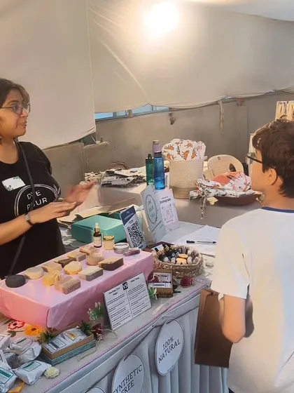 Explaining my products to a young visitor and his family at The Golden Spiral fair.