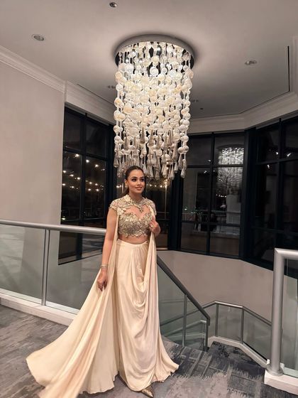 The full look under a gorgeous chandelier. This is how I style myself for a big finale party.