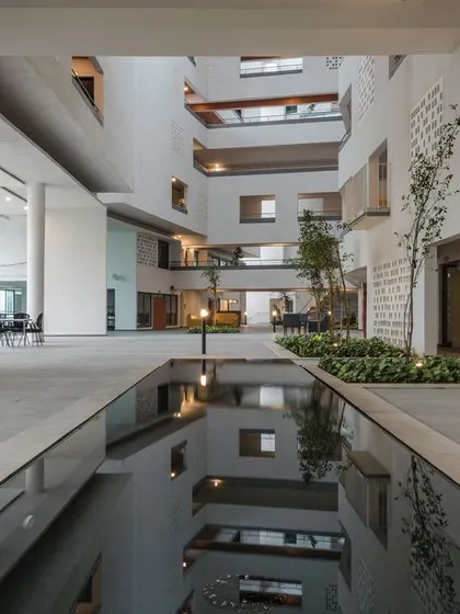 The central atrium at Parkside Retirement Homes is the heart of the community. We designed this multi-story space with a large skylight and indoor landscaping to bring in natural light and create visual connections between floors, fostering a sense of openness and interaction.