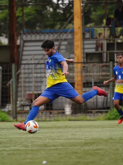 Our midfielder strikes the ball with perfect technique, demonstrating the quality we instill in our players.