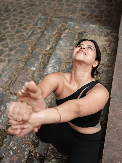 Looking up during Krounchasana. The secret lies in putting in the effort without judgment, accepting where your body is each day.