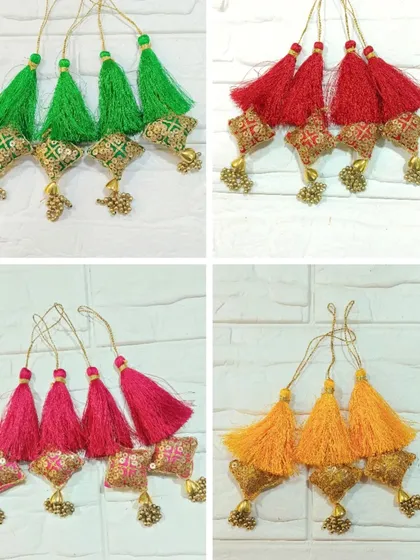 These colorful decorative tassels are perfect for adding a festive touch to torans, wall hangings, or gift hampers. This image shows a variety of colors including green, red, pink, and yellow.
