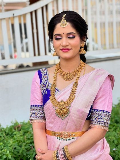 A close-up of Soundarya's makeup, featuring soft pink eyeshadow and a flawless base.