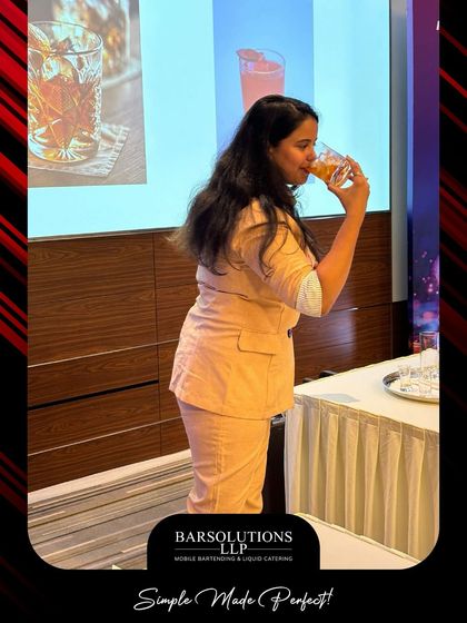 The best part of learning is tasting the results. Amisha samples the finished product, a key step in understanding flavor balance during our masterclasses.