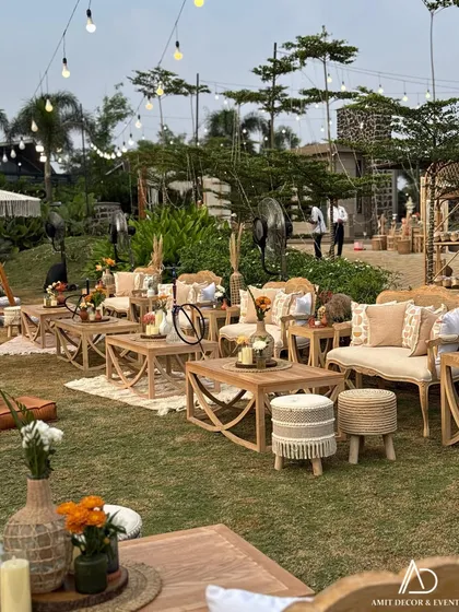 A beautiful lounge area with wooden furniture, macrame-detailed stools, and neutral-toned upholstery, perfect for a relaxed conversation.
